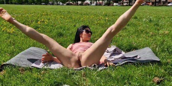 Brunette milf flashing pussy and pissing in a public park - anysex.com on systemporn.com