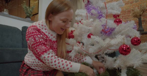MILF in miniskirt rocks Santa hat while pleasuring herself with a festive dildo on the couch - alphaporno.com on systemporn.com